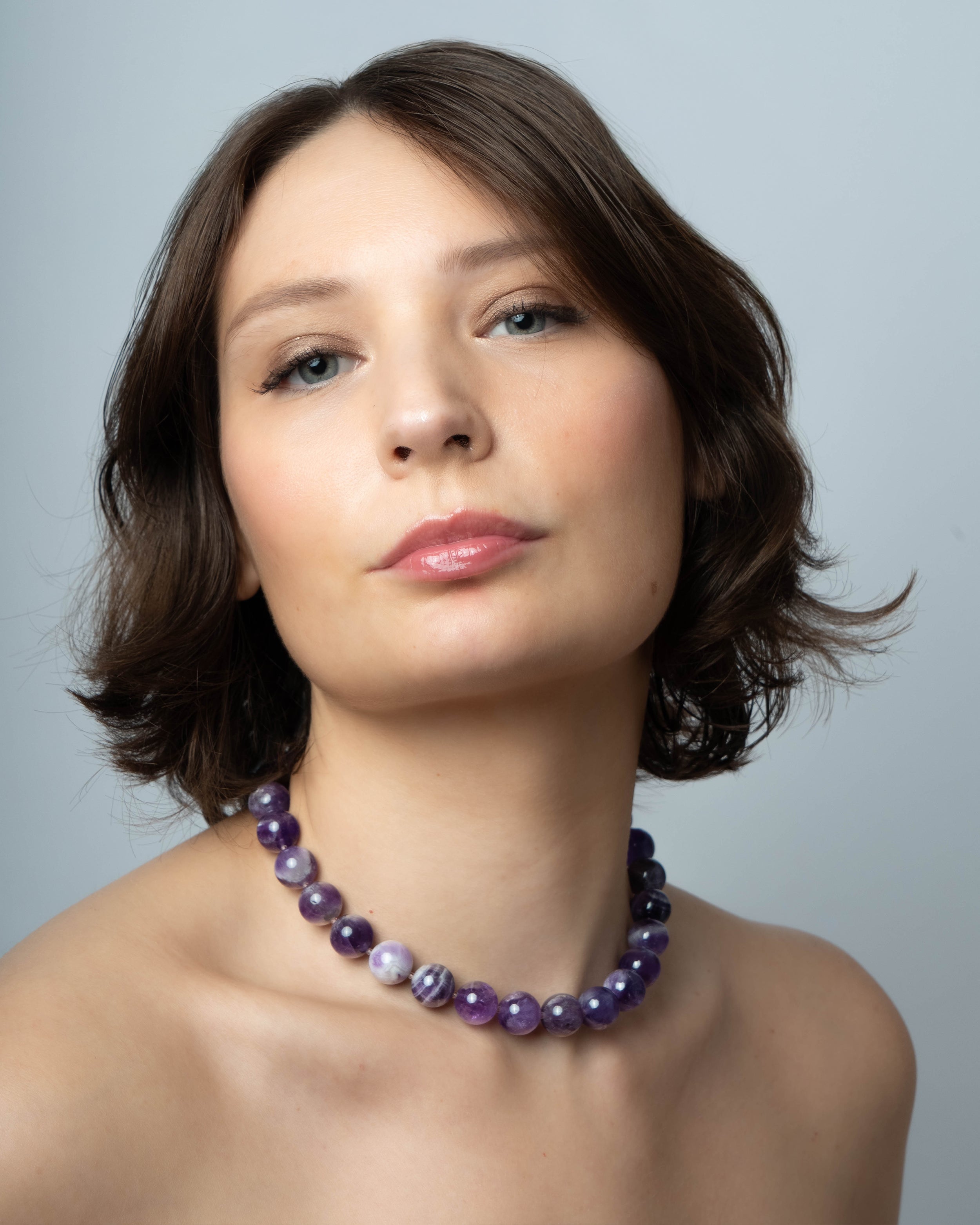 Woman wearing an amethyst  beaded necklace