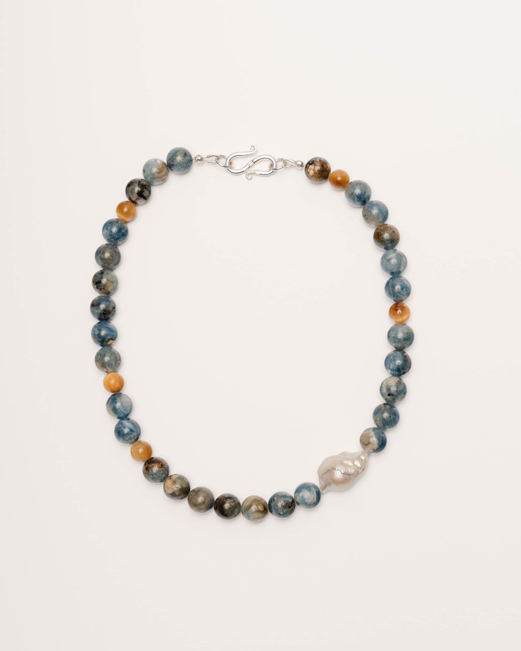 Necklace with blue and brown beads on a white background