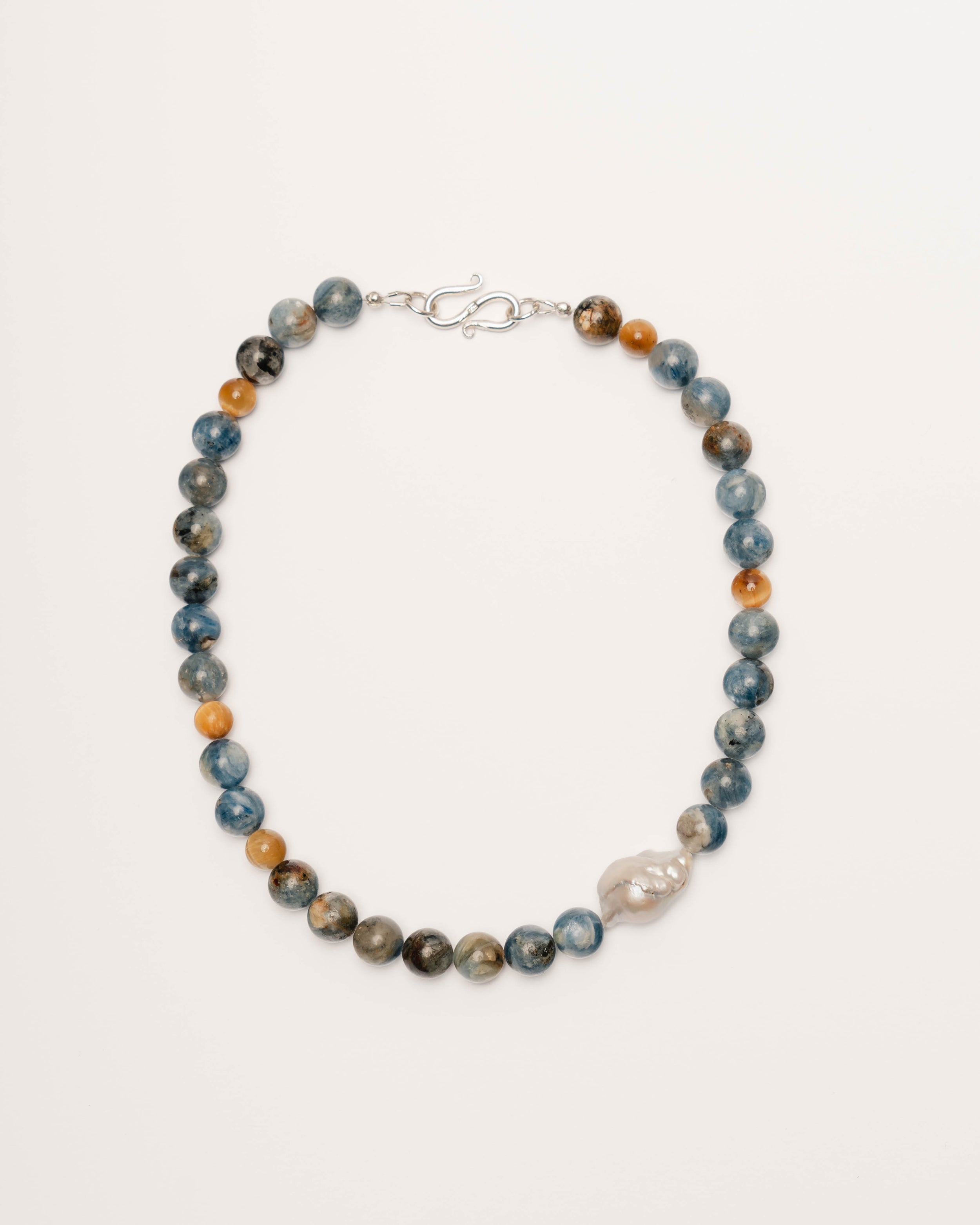 Necklace with blue and brown beads on a white background