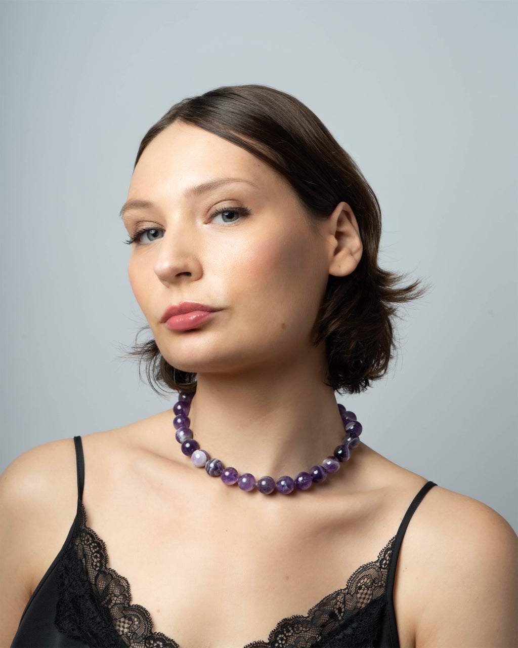 Woman wearing an amethyst  beaded necklace