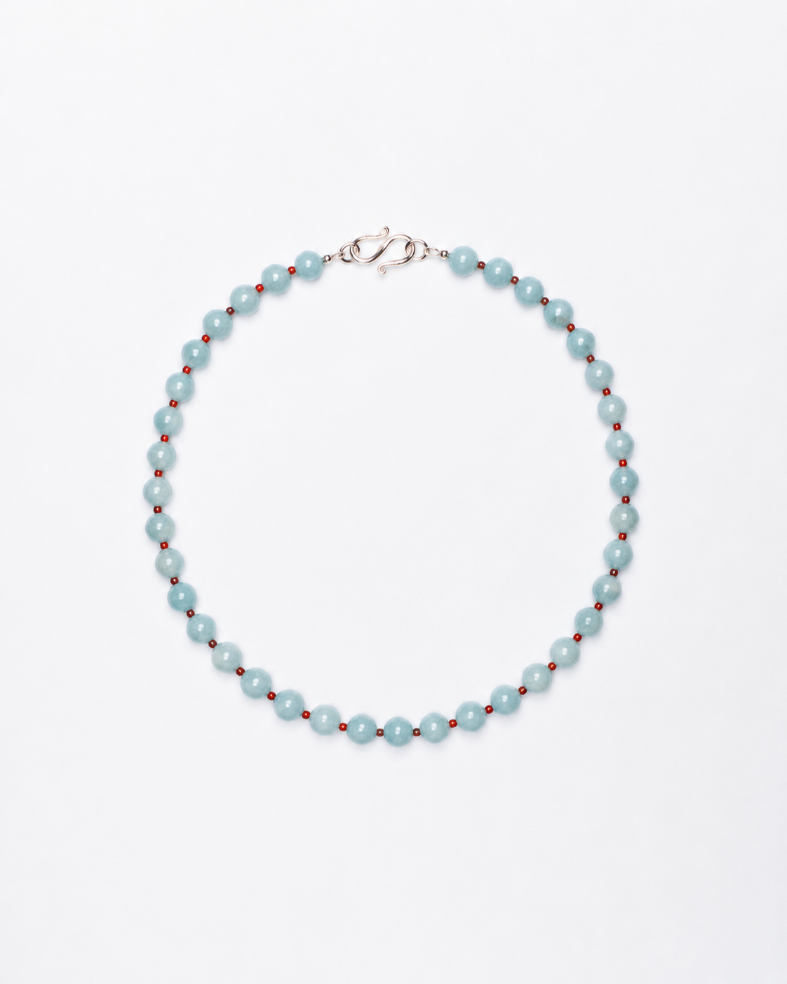Necklace with light blue beads on a white background