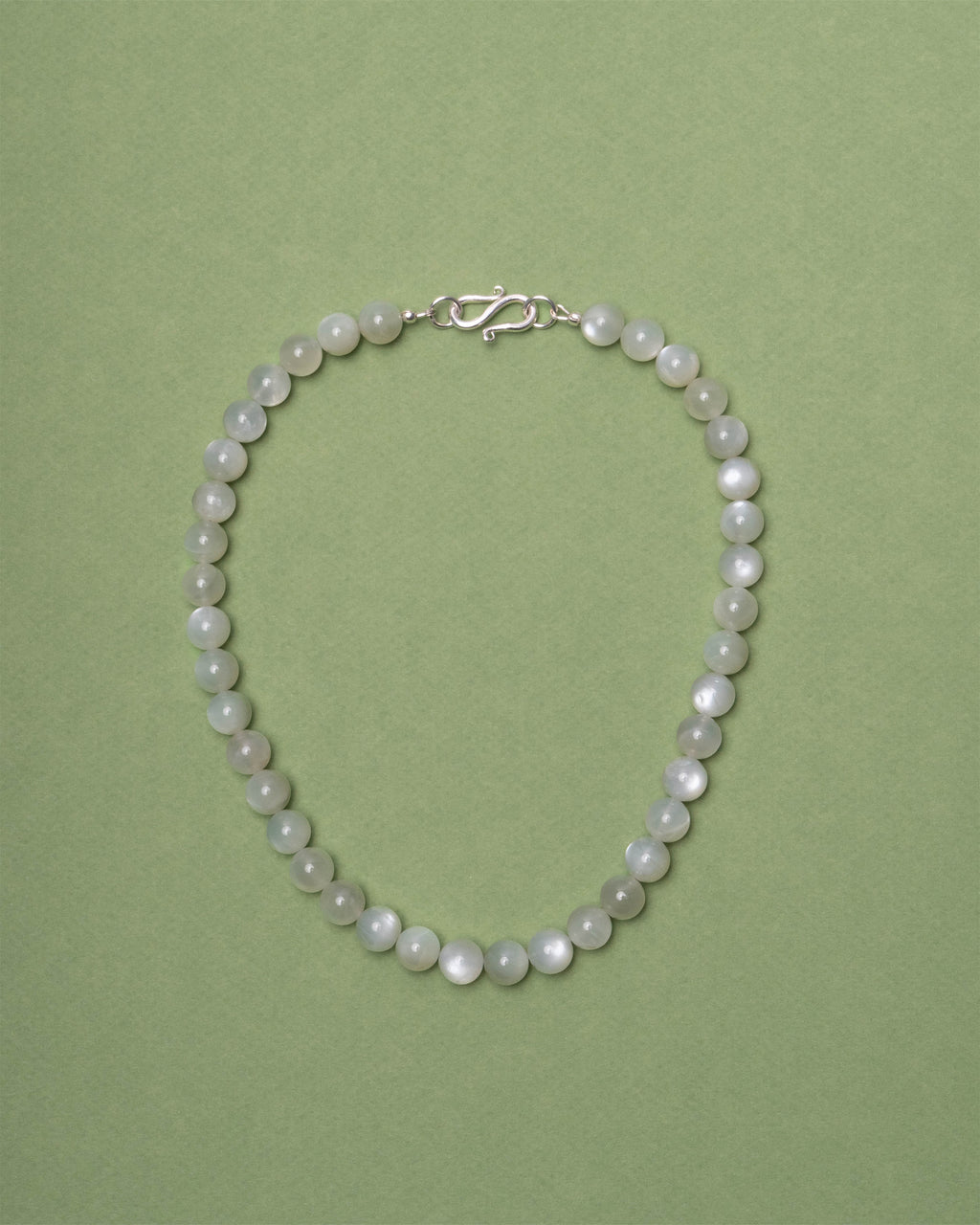 Moonstone necklace on a green background