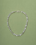 Moonstone necklace on a green background