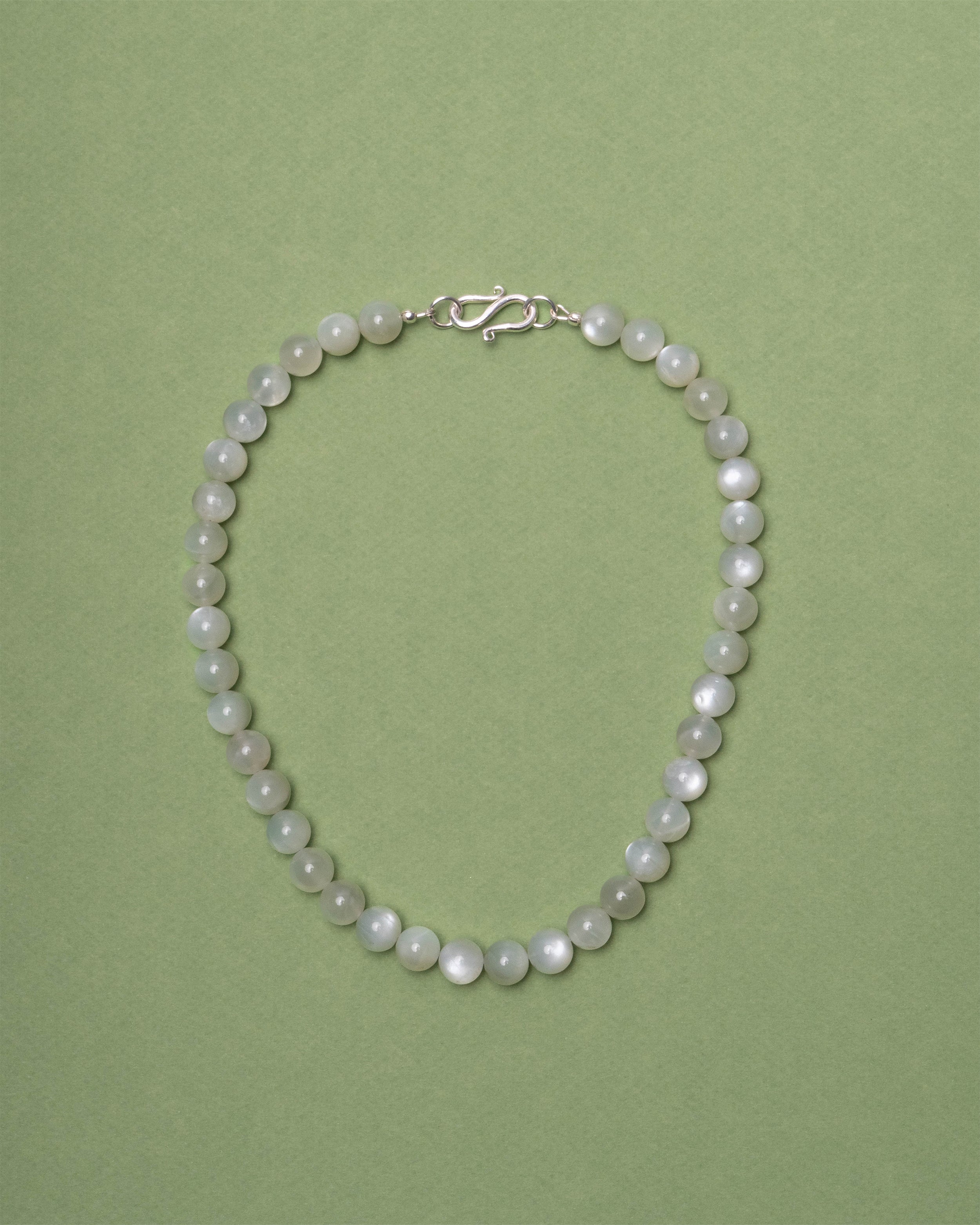 Moonstone necklace on a green background